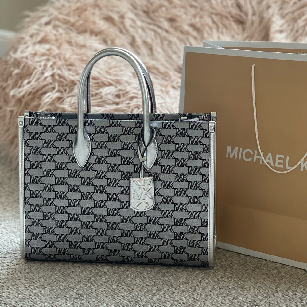 Michael Kors medium size black and silver tote with crossbody strap